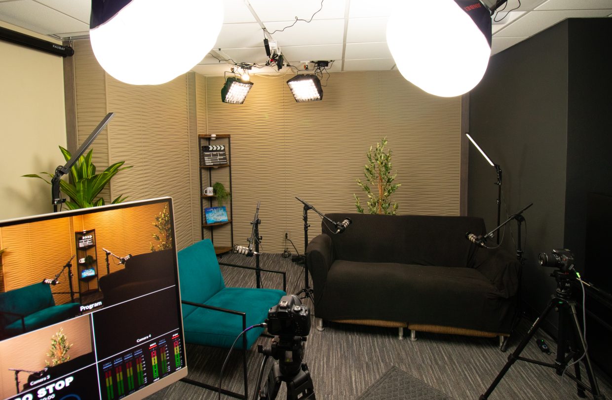 The full camera and lighting setup around a podcast conversation in the downtown Tucson studio